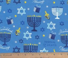 a blue background with menorah and candles