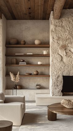 a living room filled with furniture and a fire place next to a wall mounted tv