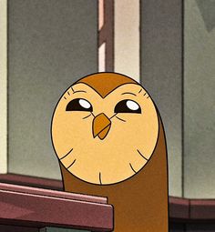 an owl with big eyes sitting on top of a wooden shelf in front of a window