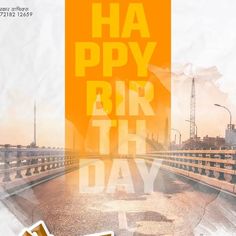 a poster with the words happy birthday written in yellow and orange on an empty road