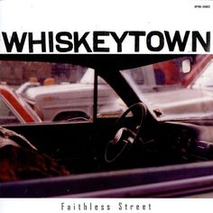 an old photo of a car with the words whiskey town on it's windshield