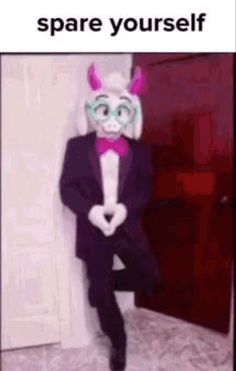 a man in a suit and bunny ears standing next to a door with the caption, you can't spare yourself