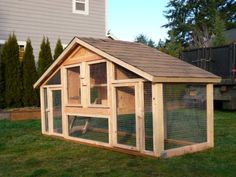 a small chicken coop in the yard