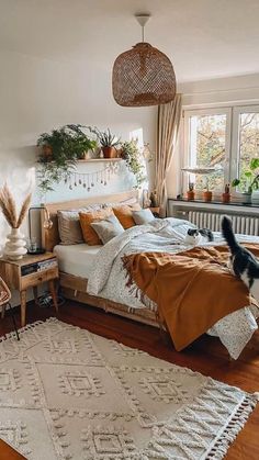 a bed room with a neatly made bed and a rug on the floor next to it