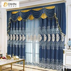 a living room with blue curtains and gold trimmings on the window sill