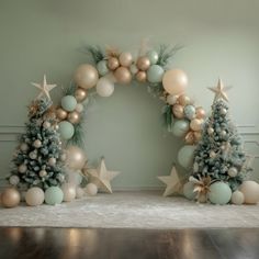 two christmas trees are decorated with gold and silver ornaments, one has a star on it