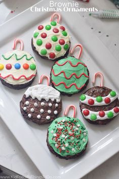 decorated christmas cookies on a white plate