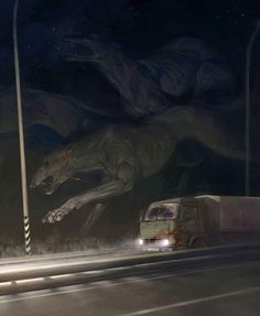 a truck driving down a street next to a giant dinosaur wall mural on the side of a building