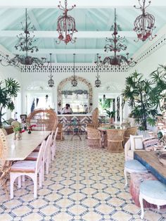 a dining room filled with lots of tables and chairs