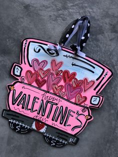 a pink valentine's card with hearts on it and the words happy valentine written in black ink