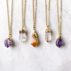 These dainty crystal necklaces are made with REAL crystal points in an easy to wear, mini size. Each stone measures approximately 0.75 inch - 1.00 inch in length. Crystal options are: Amethyst (untreated) Quartz (untreated) Citrine (heat treated) Would be great for layering and everyday wear. Metal options are gold plated brass or silver plated brass. Necklace Birthstone, Stone Pendant Necklace, Christmas Gift Jewelry, Silver Plated Necklace, Amethyst Necklace, Birthstone Necklace, Stone Pendant, Quartz Stone, Buying Jewelry