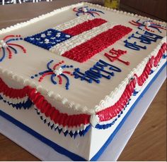 a large cake with red, white and blue frosting