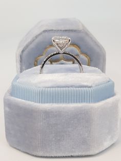 an engagement ring in a velvet box