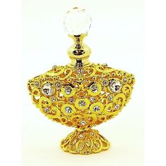 This perfume bottle is elegantly designed. Each perfume bottle handmade so details may vary slightly. Handset Austrian crystal bling accents the piece with elegance and sparkle. The bottle holds a very little amount of perfume but mostly use for decoration. The bottle will arrive in Bubble Cushion in a white storage box making it a beautiful gift or perfect for your own collection. | Astoria Grand Eby Perfume Decorative Bottle yellow 3.5 x 3.0 x 1.25 in, Metal | C000619876_1640866193 | Wayfair C Fancy Bottles, White Storage Box, Daisy Perfume, Gold Perfume, Gucci Perfume, Fenton Glassware, Crystal Perfume Bottles, Beautiful Perfume Bottle, White Storage