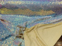 a blue and gold fabric with glitter on it