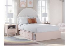 a white bed with two drawers underneath it