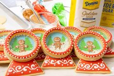 cookies decorated with icing are sitting on a table