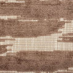 brown and white abstract textured fabric with horizontal lines in the center, closeup