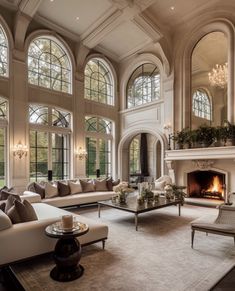 an elegant living room with high ceilings and large windows