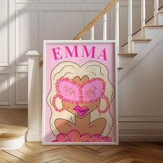 a pink poster with the name emma on it in front of a stair case