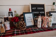 there are candy canes, candies and other items on the table with signs