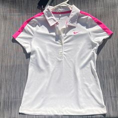 Nike Girls Golf Dri Fit Short Sleeve White And Magenta Shirt Beat The Heat On The Course With This Brand New Nike Dri-Fit Golf Shirt For Girls (Size Medium). This White And Magenta Top Features Nike's Dri-Fit Technology That Wicks Away Sweat To Keep Her Dry And Comfortable. Plus, It's Lightweight And Breathable For All-Day Wear. (New With Tags) Pink Sporty Collared Top, Sporty Pink Collared Top, Nike Collared Tops For Spring, Spring Sports Collared Tops, Fitted White Sports Shirt, White Sports Shirt For Spring, White Nike Tops For Spring, Spring Sports White Shirt, White Sporty Shirt For Spring