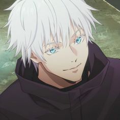 a man with white hair and blue eyes wearing a black hoodie looking at the camera