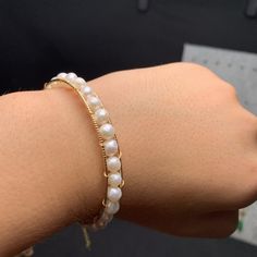 This beautiful Freshwater pearl bracelet ranges between 5-6mm in size and consists of beautiful and lustrous pearls in AAAA+ quality. All pearls in this bracelet are round and are strung with silk thread and double-knotted between each pearl. Known as the 'icon' of cultured pearls, Freshwater pearls have graced the necks, ears, fingers, and wrists of women for decades. Huge Tomato imports their Freshwater pearls from the Freshwater rs of Japan, grown in the Pinctada fucata oyster. All of our Fre Elegant Pearl Jewelry, Pearl Bangle Bracelet, Born In June, Bracelet Elegant, Freshwater Pearl Jewelry, Pearl Bangle, Freshwater Pearl Bracelet, Silk Thread, Cultured Pearls