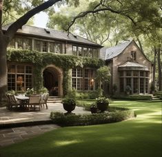 a large house surrounded by lush green trees