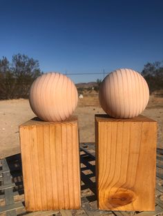 two wooden blocks sitting on top of each other