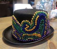 a black hat with colorful beads on it