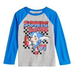 He'll show off his style with this boys' Jumping Beans Sonic the Hedgehog long sleeve graphic tee. Click on this KIDS APPAREL & SHOES GUIDE to find the perfect fit and more! He'll show off his style with this boys' Jumping Beans Sonic the Hedgehog long sleeve graphic tee. Click on this KIDS APPAREL & SHOES GUIDE to find the perfect fit and more! FEATURES Knit construction Crewneck Long sleevesFABRIC & CARE Cotton, polyester Machine wash ImportedRESPONSIBLE Supports more sustainable cotton farmin Sonic Tshirt, Blue Cartoon Print Long Sleeve Shirt, Sonic Shirt Vintage, Sonic Graphic Tee, Fun Long Sleeve T-shirt With Cartoon Print, Dinosaur Tshirt, Shoes Guide, Long Sleeve Graphic Tee, His Style