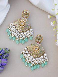 Statement earrings for a statement look! These handmade high quality kundan polki and meenakari earrings available in olive green and sky blue colours are a unique addition to your outfit to glam it up! These can be paired with both Indian and western outfits. They are also extremely lightweight because they are handcrafted. Easy on your ears and beautiful for the eyes 💖 For any queries, please reach out to us. Happy shopping! Luxury Multicolor Bridal Earrings For Diwali, Sky Blue Earrings Indian, Green Chandbali Danglers For Party, Green Cutdana Bridal Earrings For Party, Festive Green Chandelier Earrings For Party, Festive Kundan Chandelier Earrings With Meenakari, Green Chandbali Chandelier Earrings For Party, Traditional Green Earrings With Zari Work, Heavy Green Chandelier Earrings For Party