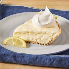 a slice of lemon pie with whipped cream on top