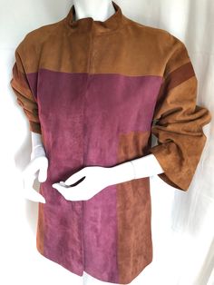 This boxy colorblock patchwork suede barn jacket is a classic, STEALTH WEALTH collectors piece, designed in the late mod 1960s or earliest boho 70s by Bonnie Cashin for Sills. This is Bonnie Cashin at her BEST and a pre-creed example of her revolutionary design, keeping ladies-comfort and freedom of movement at the top-of-mind, in a liberated fit and high style. Shiny brass ovoid snaps and plush soft supple and pliable brushed suede, are just a couple of things that make make this au-courant perfectly seamed and constructed 'Car Coat'...STUNNING! In amazing condition without issues. The sleeves are cut on a dolman shoulder and classic glove-length, and it is fully lined...Best on an XS to petite SMALL. - Seamless dolman shoulder accommodates 16" - 16.5" at most - Bust has range between 32" Luxury Fitted Coach Outerwear, Luxury Coach Women's Outerwear, Luxury Classic Leather Jacket With Suede Lining, Luxury Chic Suede Leather Jacket, Stealth Wealth, Minimalist Dress, Bonnie Cashin, Suede Blazer, 70s Boho