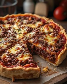 a pizza sitting on top of a wooden cutting board