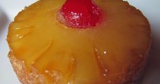 a pineapple upside down cake with a cherry on it's top, ready to be eaten