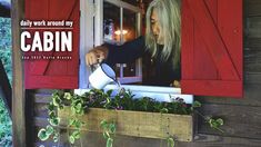 a woman pouring water into a window box