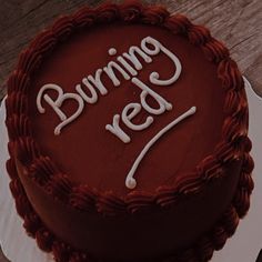 a cake with the words burning red on it