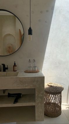 a bathroom with a sink and mirror in it