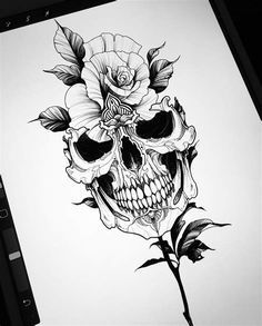 a black and white drawing of a skull with flowers on it's head, next to an iphone