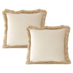 two white pillows with ruffled edges