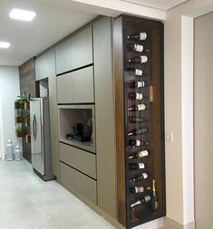 a wine rack in the middle of a kitchen