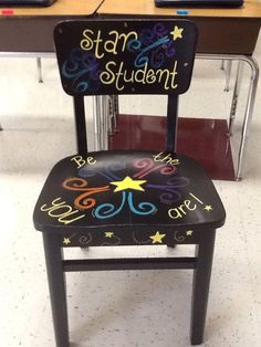 a black chair with chalk writing on it