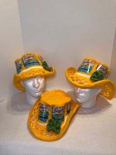 three hats made out of crochet are sitting on top of a mannequin's head