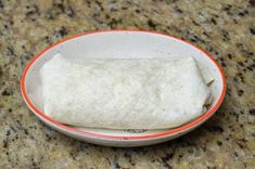 a bowl filled with food sitting on top of a counter