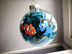 an ornament hanging from a window with two clown fish