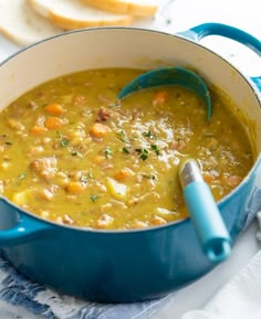 a blue pot filled with soup on top of a table