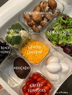 an organized meal prep tray with vegetables, cheese and other foods labeled in the words