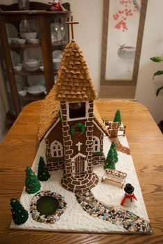 a gingerbread house made to look like it is going to be built on the table